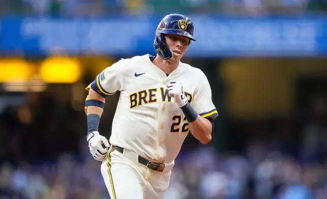 Milwaukee Brewers designated hitter Christian Yelich runs the bases after hitting a three-run home run during the first inning of a baseball game against the Chicago Cubs Wednesday, Sept. 9, 2026, in Milwaukee. (AP Photo/Kayla Wolf)