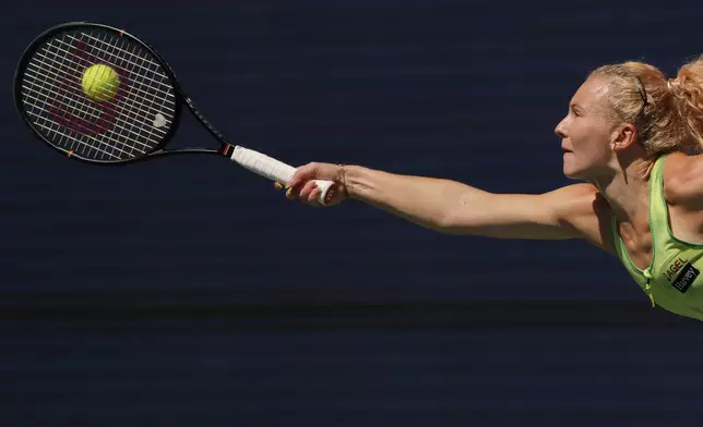 Katerina Siniakova, of the Czech Republic, returns the ball to Naomi Osaka, of Japan, during the second round of the U.S. Open tennis championships against Thursday, Sept. 3, 2026, in New York. (AP Photo/Andres Kudacki)