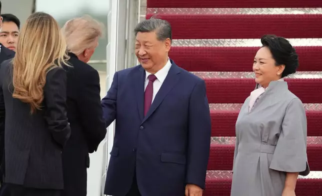 President Donald Trump and first lady Melania Trump greet China's President Xi Jinping and his wife Peng Liyuan at Joint Base Andrews, Md., Wednesday, Sept. 23, 2026.(AP Photo/Alex Brandon)