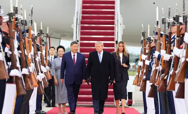 President Donald Trump and first lady Melania Trump walk with China's President Xi Jinping and his wife Peng Liyuan at Joint Base Andrews, Md., Wednesday, Sept. 23, 2026.(AP Photo/Alex Brandon)