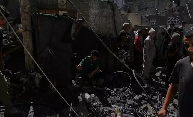 Palestinians inspect a building destroyed in an Israeli airstrike in Gaza City, Wednesday, Sept. 9, 2026. (AP Photo/Jehad Alshrafi)