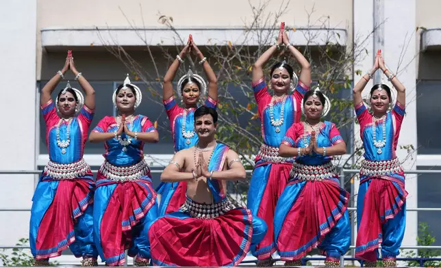 A group dances during a pre-game ceremony before the India vs Japan Suzuki Cup T20 cricket match in Sano, Japan, Tuesday, Sept. 22, 2026, marking 75 years of diplomatic relations between the two countries. (AP Photo/Tomohiro Ohsumi)