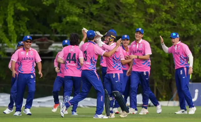 Japan's players celebrate a Indian wicket during the Suzuki Cup T20 cricket match in Sano, Japan, Tuesday, Sept. 22, 2026, marking 75 years of diplomatic relations between the two countries. (AP Photo/Tomohiro Ohsumi)
