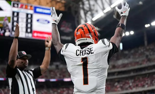 Cincinnati Bengals wide receiver Ja'marr Chase (1) celebrates after catching a pass for a touchdown during the first half of an NFL football game against the Houston Texans in Houston, Sunday, Sept. 20, 2026. (AP Photo/Ashley Landis)