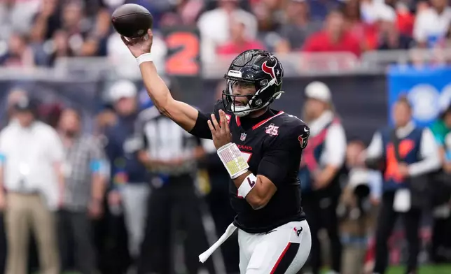 Houston Texans quarterback C.J. Stroud throws a pass during the first half of an NFL football game against the Cincinnati Bengals in Houston, Sunday, Sept. 20, 2026. (AP Photo/David J. Phillip)