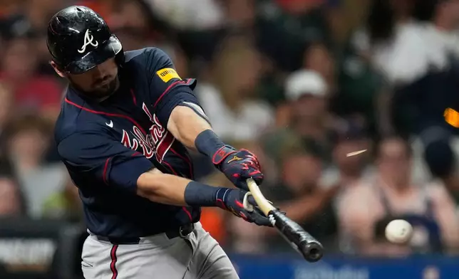 Atlanta Braves' Austin Riley breaks a bat as he lines out during the sixth inning of a baseball game against the Houston Astros in Houston, Friday, Sept. 18, 2026. (AP Photo/Ashley Landis)