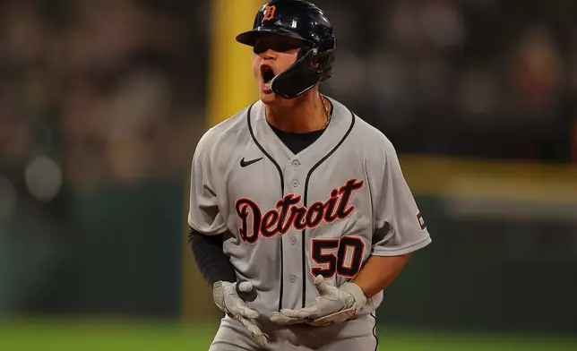 Detroit Tigers' Hao-Yu Lee celebrates his two-run home run during the eighth inning of a baseball game against the Chicago White Sox, Friday, Sept. 18, 2026, in Chicago. (AP Photo/Melissa Tamez)