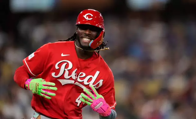 Cincinnati Reds' Elly de la Cruz gestures toward his dugout after hitting a two-run home run during the third inning of a baseball game against the Los Angeles Dodgers, Tuesday, Sept. 8, 2026, in Los Angeles. (AP Photo/Mark J. Terrill)