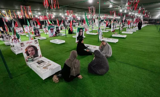 Women visit a section of Minab's cemetery that was set aside for those killed in a Feb. 28 U.S. airstrike on Shajareh Tayyebeh school, in Minab, southern Iran, Monday, Sept. 7, 2026. (AP Photo/Vahid Salemi)