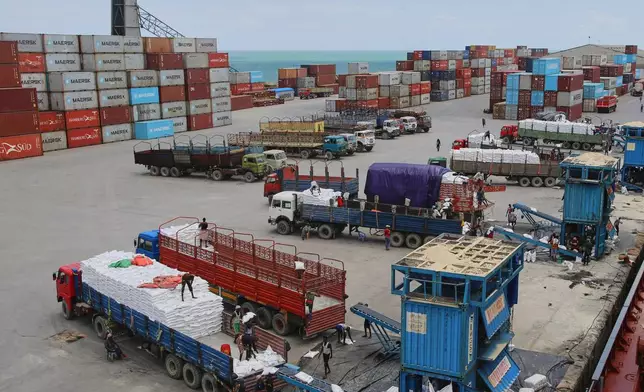 Workers load cargo at the port in Mogadishu, Somalia, Sunday, Sept. 13, 2026. (AP Photo/Farah Abdi Warsameh)