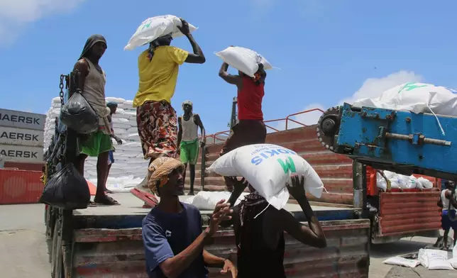 Workers load cargo at the port in Mogadishu, Somalia, Sunday, Sept. 13, 2026. (AP Photo/Farah Abdi Warsameh)