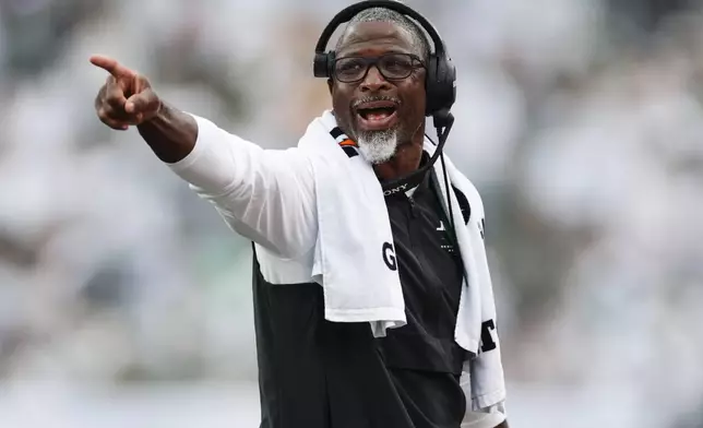 New York Jets head coach Aaron Glenn points on the field during an NFL football game against the Green Bay Packers in East Rutherford, N.J., Sunday, Sept. 20, 2026. (AP Photo/Adam Hunger)