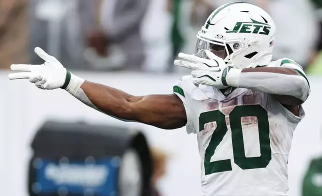 New York Jets running back Breece Hall (20) reacts during an NFL football game against the Green Bay Packers in East Rutherford, N.J., Sunday, Sept. 20, 2026. (AP Photo/Adam Hunger)