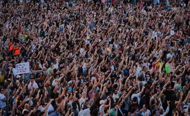 People gather during a protest following the eviction last Wednesday of 87-year-old Maricarmen to demand stronger laws to protect renters at Puerta del Sol in Madrid, Spain, Saturday, Sept. 26, 2026. (AP Photo/Manu Fernandez)