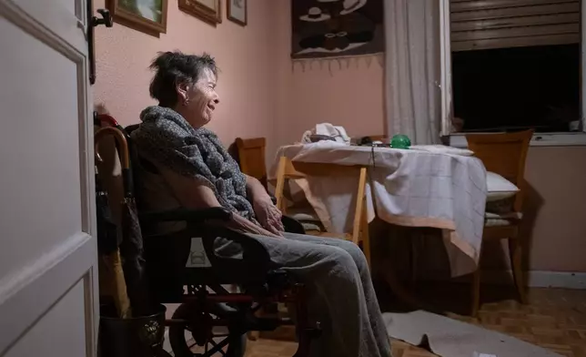 Maricarmen, 87, waits at home for police to arrive before being evicted from the home where she lived in Madrid, Spain, Wednesday, Sept. 23, 2026. (Fernando Sánchez/Europa Press via AP)