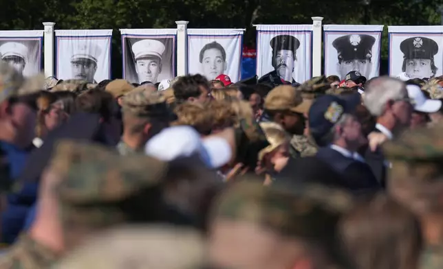 Photos are on display during the Tunnel to Towers Foundation event for the 25th Anniversary of 9/11, on the Ellipse near the White House in Washington, Tuesday, Sept. 8, 2026. (AP Photo/Jacquelyn Martin)