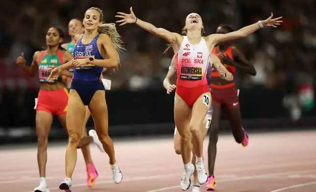 Klaudia Kazimierska, of Poland, reacts after winning the women's 1,500 meters final during the World Athletics Ultimate Championship in Budapest, Hungary, Saturday, Sept. 12, 2026. (AP Photo/Armin Durgut)