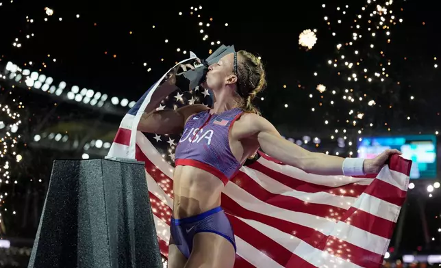 Sandi Morris, of the United States, poses with her trophy after winning the women's pole vault final at the World Athletics Ultimate Championship in Budapest, Hungary, Saturday, Sept. 12, 2026. (AP Photo/Matthias Schrader)