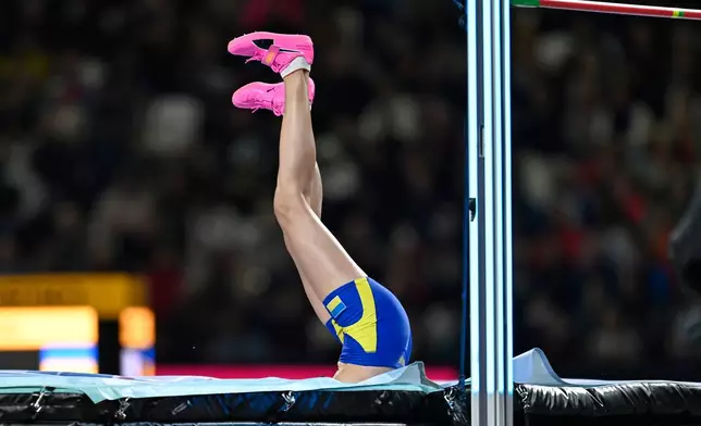 Yaroslava Mahuchikh, of Ukraine clears the bar during the women's high jump final at the World Athletics Ultimate Championship in Budapest, Hungary, Friday, Sept. 11, 2026. (AP Photo/Denes Erdos)