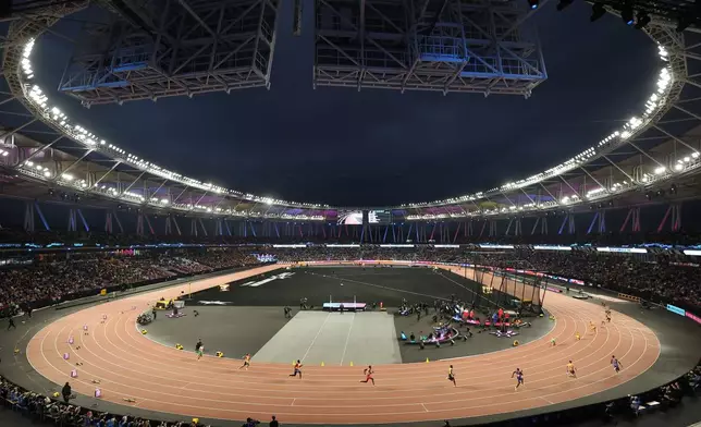 Athletes compete in the mixed 4 X 100 meters relay final during the World Athletics Ultimate Championship in Budapest, Hungary, Friday, Sept. 11, 2026. (AP Photo/Armin Durgut)