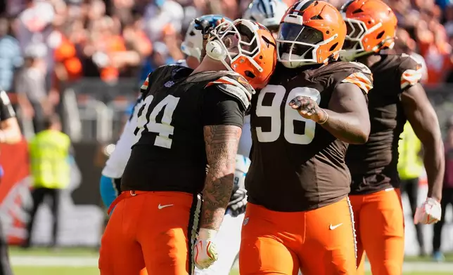 Cleveland Browns defensive tackle Mason Graham (94) celebrates after making a sack against the Carolina Panthers during the second half of an NFL football game in Cleveland, Thursday, Aug. 27, 2026. (AP Photo/Sue Ogrocki)
