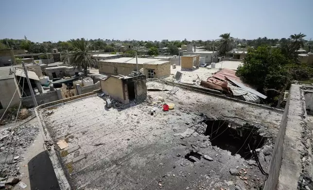 The point of impact is seen on the roof of a building that Iranian media said was hit by a U.S. strike while a wedding celebration was taking place there late Tuesday, Sept. 1, in Kuhestak, southern Iran, Friday, Sept. 4, 2026. (AP Photo/Vahid Salemi)