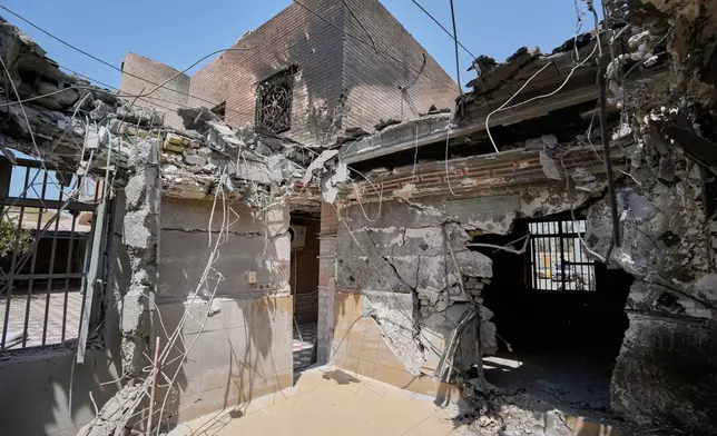 Damage is seen inside a home whose roof was destroyed in what Iranian media said was a U.S. strike while a wedding celebration was taking place late Tuesday, Sept. 1, in Kuhestak, southern Iran, Friday, Sept. 4, 2026. (AP Photo/Vahid Salemi)