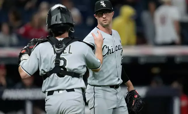 Chicago White Sox pitcher Trevor Richards, right, and catcher Kyle Teel (8) shake hands after the Chicago White Sox defeated the Cleveland Guardians in a baseball game in Cleveland, Monday, Sept. 14, 2026. (AP Photo/Sue Ogrocki)