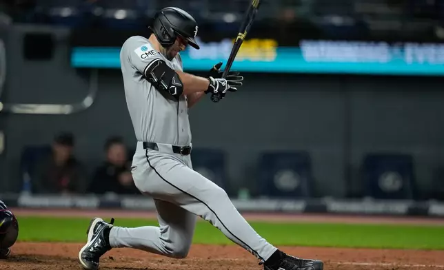 Chicago White Sox's Tristan Peters falls after being hit by a pitch in the ninth inning of a baseball game against the Cleveland Guardians in Cleveland, Monday, Sept. 14, 2026. (AP Photo/Sue Ogrocki)