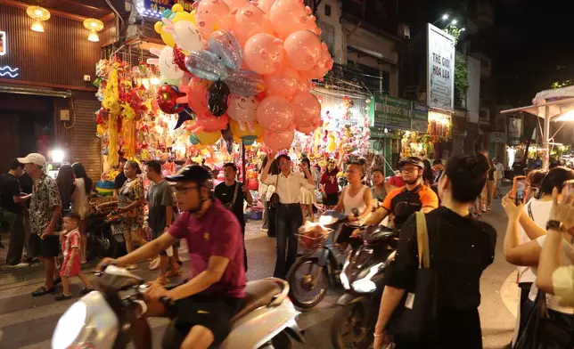 A Vietnamese shop for festive goods ahead of the Mid-Autumn Festival in Hanoi's Old Quarter, Tuesday, Sept. 22, 2026. (AP Photo/Aniruddha Ghosal)
