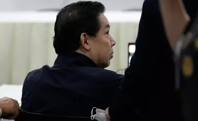 Philippines former House Speaker Martin Romualdez, a cousin of President Ferdinand Marcos Jr., waits for the start of his arraignment via video conference at the Quezon City Jail in Quezon, Philippines, Wednesday, Sept. 16, 2026. (AP Photo/Aaron Favila, Pool)