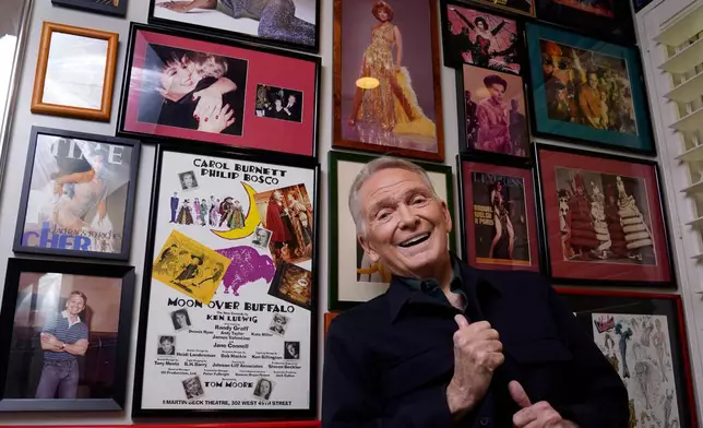 FILE - Costume and fashion designer Bob Mackie poses at his home in Palm Springs, Calif., on Oct. 20, 2021. (AP Photo/Chris Pizzello, File)
