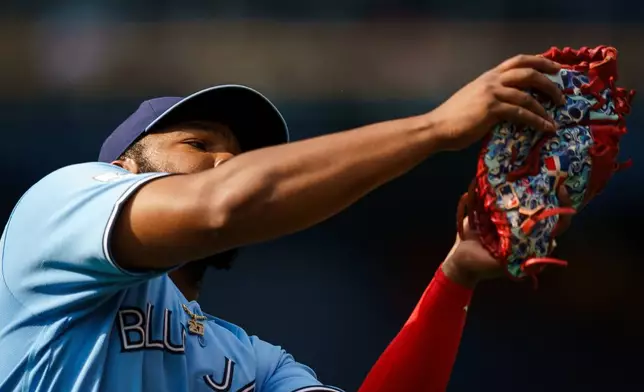 Toronto Blue Jays' Vladimir Guerrero Jr. (27) catches a pop fly from Detroit Tigers' Dillon Dingler (13) during the fourth inning of a baseball game in Toronto, Wednesday, Sept. 16, 2026. (Nathan Denette/The Canadian Press via AP)
