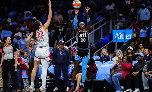 Atlanta Dream guard Rhyne Howard (10) shoots against Washington Mystics guard Sonia Citron (22) during the first half in Game 1 of an WNBA basketball first-round playoff series, Sunday, Sept. 27, 2026, in Atlanta. (AP Photo/Colin Hubbard)