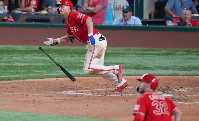Texas Rangers' Corey Seager watches his RBI double to score teammate Evan Carter (32) during the second inning of a baseball game against the Toronto Blue Jays, Friday, Sept. 18, 2026, in Arlington, Texas. (AP Photo/Julio Cortez)