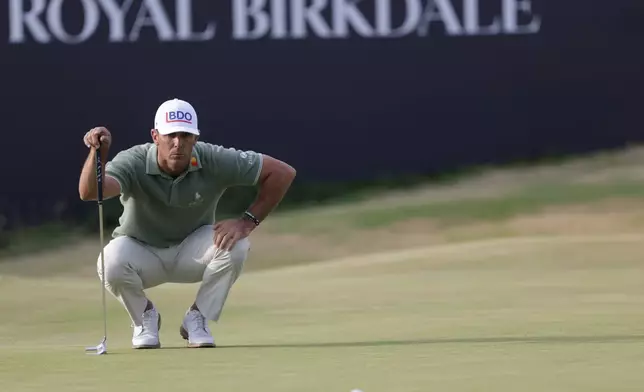 FILE - Billy Horschel of the United States looks at the lie of his putt on the 18th green during the first day of the British Open Golf championships at Royal Birkdale golf club, in Southport, England, Thursday, July 16, 2026. (AP Photo/Peter Morrison, File)