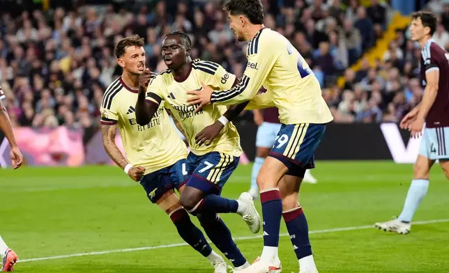 Arsenal's Bukayo Saka (7) celebrates after scoring his side's opening goal during the English Premier League soccer match between Aston Villa and Arsenal in Birmingham, England, Monday, Aug. 31, 2026. (Nick Potts/PA via AP)