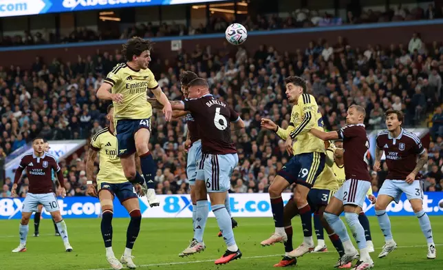 Arsenal's Declan Rice heads the ball during the English Premier League soccer match between Aston Villa and Arsenal in Birmingham, England, Monday, Aug. 31, 2026. (AP Photo/Morgan Harlow)