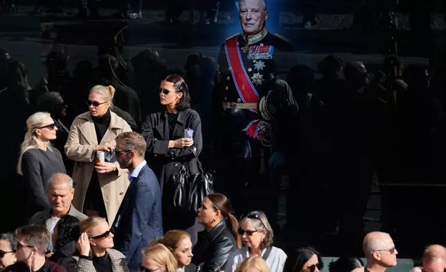 Members of the public wait along the route of the procession for the funeral of Norway's King Harald V near Oslo Cathedral in Oslo, Wednesday, Sept. 9, 2026. (AP Photo/Markus Schreiber)