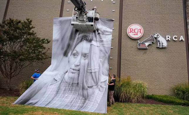 A portrait of the late Dolly Parton is installed outside RCA Studio A, Wednesday, Sept. 23, 2026, in Nashville, Tenn. where she recorded "Jolene" and "I Will Always Love You" during a 1973 recording session. (AP Photo/George Walker IV)