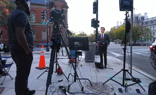 Vaughn Hillyard, White House correspondent for MS NOW, does a report from near the White House,, Monday, Sept. 21, 2026, in Washington. (AP Photo/Mark Schiefelbein)