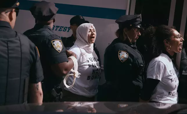 Police arrest protesters blocking a road outside United Nations headquarters during a Jewish Voice for Peace sit-in against Israeli Prime Minister Benjamin Netanyahu on Thursday, Sept. 24, 2026, in New York. (AP Photo/Andres Kudacki)