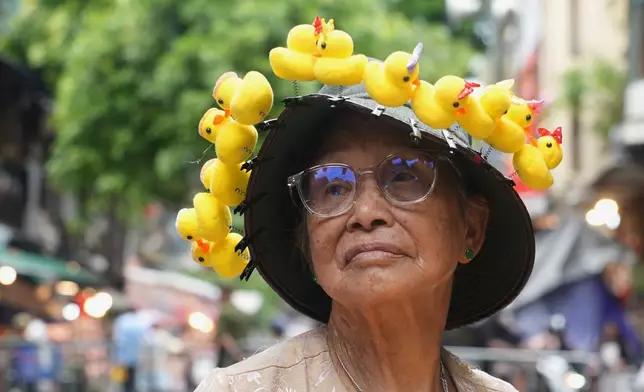 A street vendor sells duckling hair clips at the Mid Autumn Festival Market in Hanoi, Vietnam, Thursday, Sept. 24, 2026. (AP Photo/Hau Dinh)