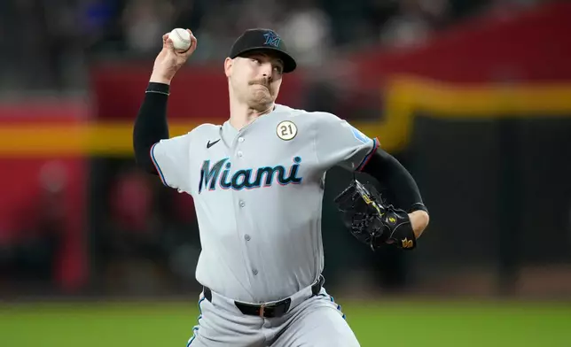 Miami Marlins starting pitcher Janson Junk throws against the Arizona Diamondbacks during the first inning of a baseball game, Tuesday, Sept. 15, 2026, in Phoenix. (AP Photo/Ross D. Franklin)