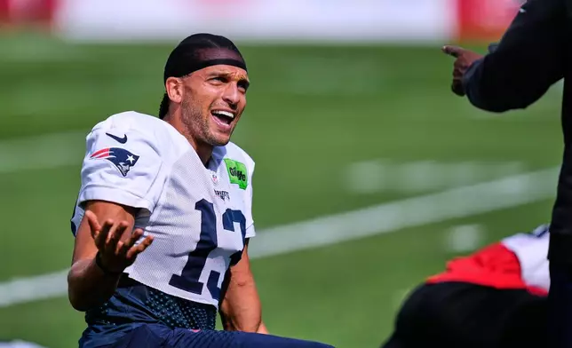 New England Patriots wide receiver Mack Hollins (13) jokes with a coach during an NFL football practice, Wednesday, Sept. 16, 2026, in Foxborough, Mass. (AP Photo/Charles Krupa)
