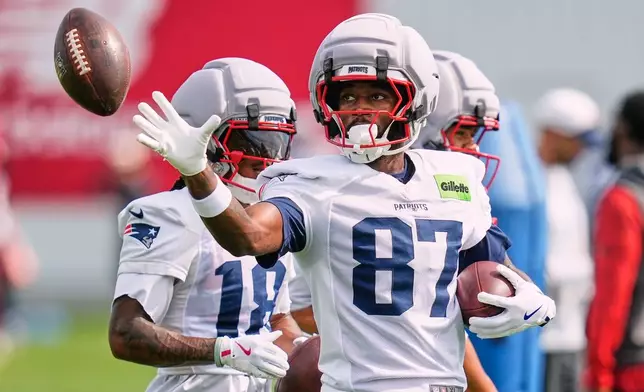 New England Patriots wide receiver Romeo Doubs grabs a pass during an NFL football practice, Wednesday, Sept. 16, 2026, in Foxborough, Mass. (AP Photo/Charles Krupa)
