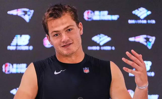 New England Patriots quarterback Drake Maye answers questions during a media availability after an NFL football practice, Wednesday, Sept. 16, 2026, in Foxborough, Mass. (AP Photo/Charles Krupa)
