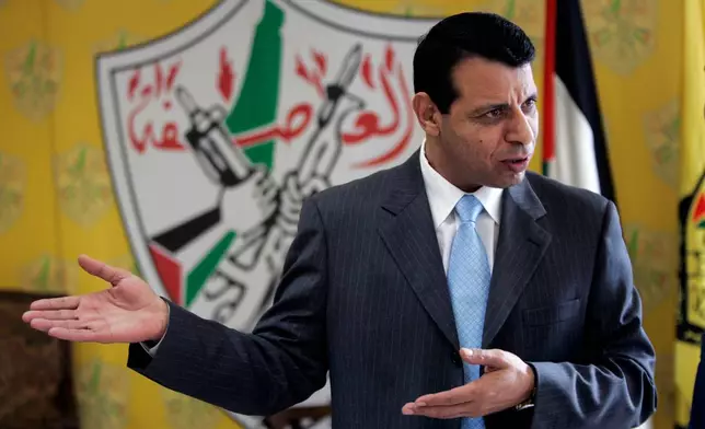 FILE - Palestinian Fatah leader Mohammed Dahlan gestures in his office in the West Bank city of Ramallah on Jan. 3, 2011. (AP Photo/Majdi Mohammed, File)