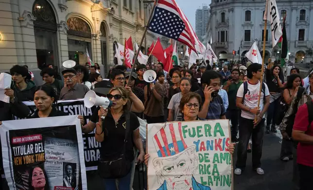 People protest the visit of U.S. Secretary of State Marco Rubio in Lima, Peru, Wednesday, Sept. 9, 2026. (AP Photo/Guadalupe Pardo)