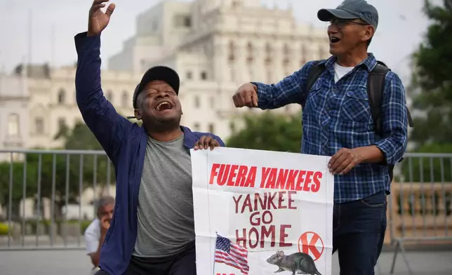 People protest the visit of U.S. Secretary of State Marco Rubio in Lima, Peru, Wednesday, Sept. 9, 2026. (AP Photo/Guadalupe Pardo)